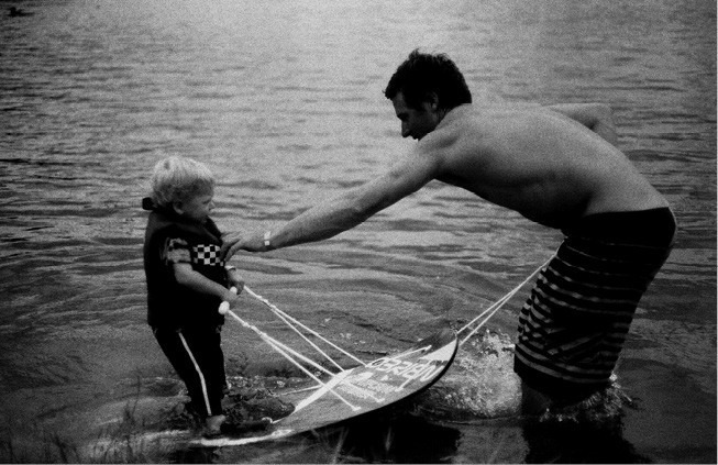 Daniel teaching young Taylor to ski